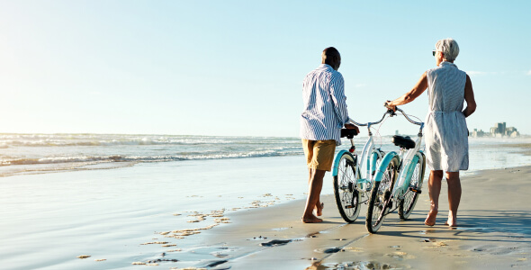 Couple on a beach with bikes